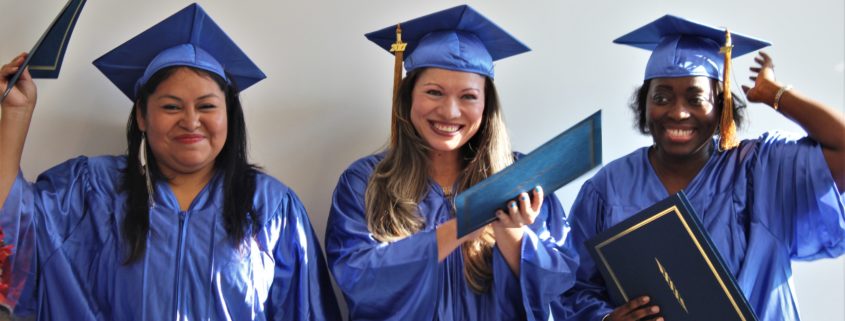 Three Briya high school graduates smiling with diplomas